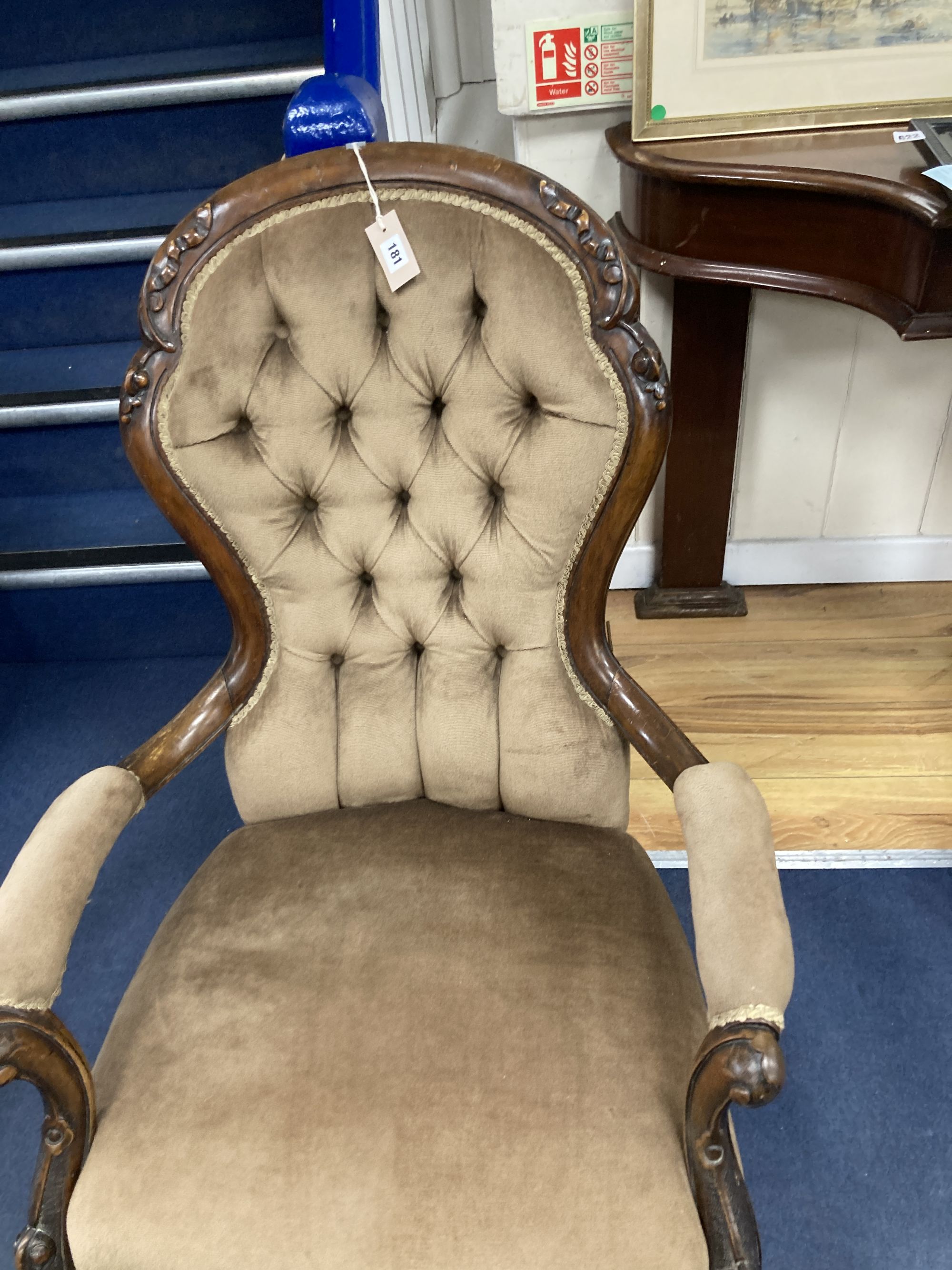A Victorian walnut spoon back open elbow chair, width 70cm, depth 70cm, height 96cm